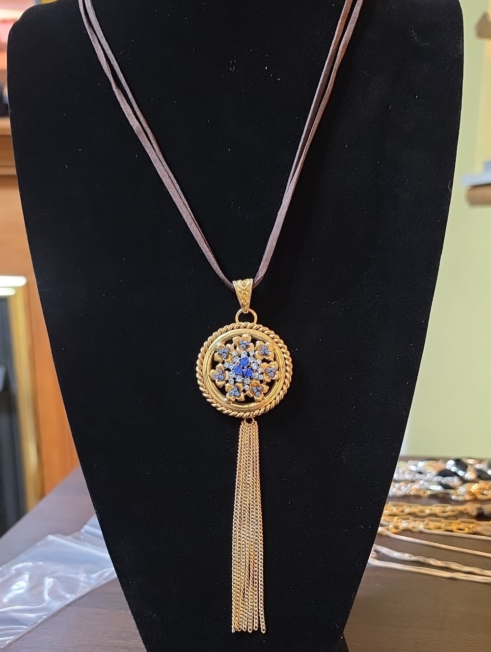 A199- Gold Tone Blue Crystal Tassel Pendant Necklace